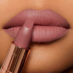 Charlotte Tilbury open packaging revealing tube and interior branding for premium presentation