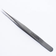 CHAZÓN tweezers front view showing straight-point tips and ergonomic grip for precise grooming