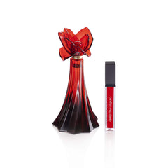 Christian Siriano gloss application on lips demonstrating shine and coordinated look