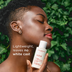 Clarins UV Plus on face and neck demonstrating even coverage and no white cast