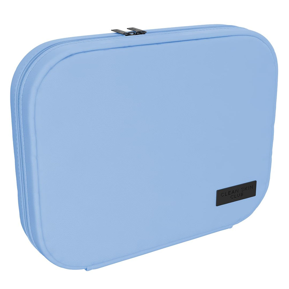 CLEAN SKIN CLUB pouch front view showing compact blue design and easy packing benefit