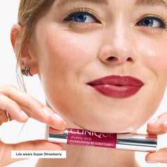Clinique Chubby Stick swatch on arm showing Super Strawberry shade and buildable color