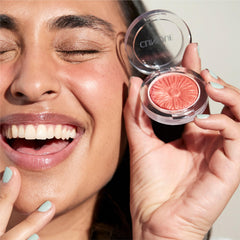 Clinique Pansy Pop swatch on arm demonstrating intensity options