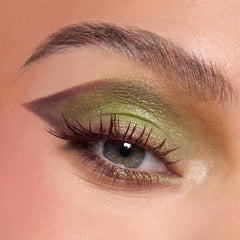 ColourPop Shrek palette metallic lid swatch showing reflective shimmer and bright impact