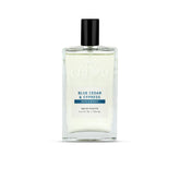 Cremo bottle front view showing woodsy citrus fragrance and clean design