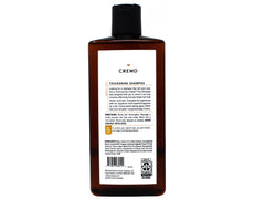 Cremo bottle in shower with lather demonstrating easy use and gentle cleansing benefit