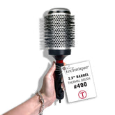Cricket thermal brush front view showing barrel and handle, aids precise styling