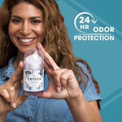 Crystal Essence stick held in hand to show size and scale, portable benefit