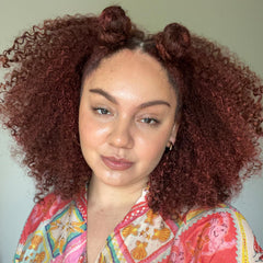 CURLSMITH applying ruby to a curl strand for instant color and definition