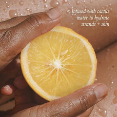 DAE hair misted in use showing scent refresh and added shine benefit