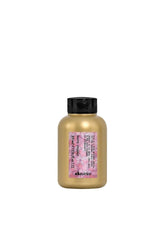 Davines travel-size bottle front view showing compact curl serum benefit