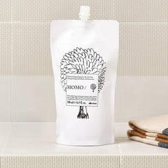 Davines MOMO shampoo lather in hands demonstrating gentle cleansing benefit