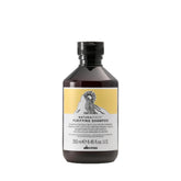 Davines front bottle showing Naturaltech Purifying Shampoo benefit of scalp purification
