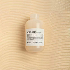 Davines NOUNOU pump and cap detail highlighting ease of use benefit