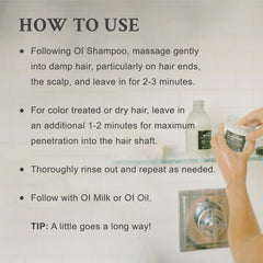 Davines OI Conditioner being applied in shower for easier detangling benefit