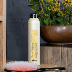 davines bottle in hand demonstrating easy control benefit