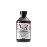 Davines replumping shampoo bottle front view showing premium packaging and salon-grade performance