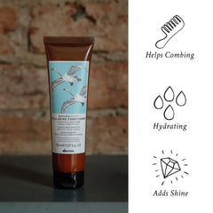 Davines wellbeing conditioner cream texture on palm for visible hydration benefit