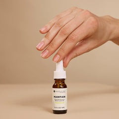 Close-up of Dazzle Dry oil texture on skin, emphasizes fast absorption