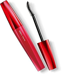 deja vu cosmetics close-up of brush applying fibers for precise lash lengthening