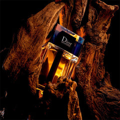 Dior Homme bottle beside a common item to show 1.7 oz portable size benefit