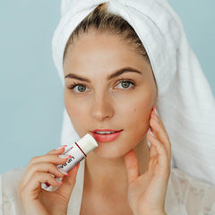 Dmsky single tube in hand showing compact 0.15 oz size for portability