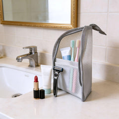 DomesticEdge interior view showing dividers and elastic loops to keep toiletries organized