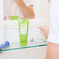 Dr. Bronner's tea tree shaving soap tub close-up showing clarifying skincare benefit