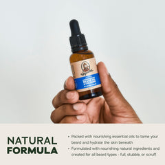 Dr. Squatch dropper releasing oil into beard, showing easy application