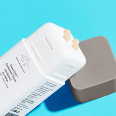 Drunk Elephant being applied with fingertip demonstrating easy, minimal-use application