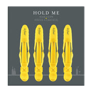 Drybar Hold Me front view showing four clips and neat packaging, professional grip benefit