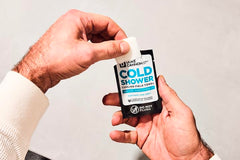 Person using a Duke Cannon wipe for post-workout cooling and quick refresh