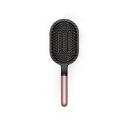 Dyson paddle brush front view shows wide head for faster smoothing