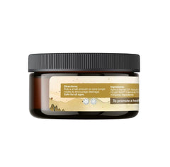 Earthley Wellness cream on spoon ready to apply for easy targeted massage