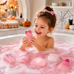 Eletorot pumpkin-shaped bath bomb fizzing in bathtub showing colorful bath transformation benefit