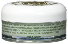Eminence applying cream to face at night for overnight renewal