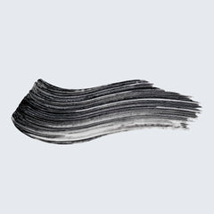 Estée Lauder close-up of primer on lashes revealing tinted black finish for visible definition