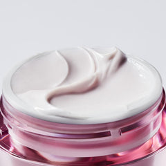 Estée Lauder cream applied to fingertip demonstrating easy spread and nourishment