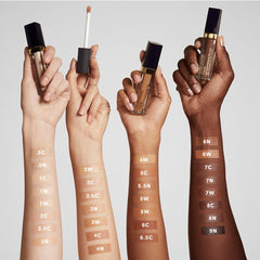 Estée Lauder shade 2N droplet beside ruler to show size and coverage scale