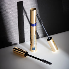 Estée Lauder travel-size tube held in hand showing portable scale benefit