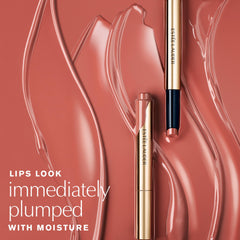 Estée Lauder applying glosstick to lips demonstrating smooth, melt-on glide benefit