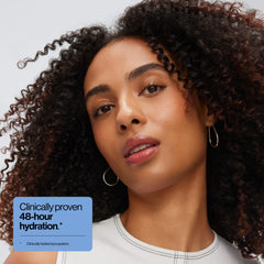 Eva NYC conditioner cream texture on hand highlighting smooth detangling benefit