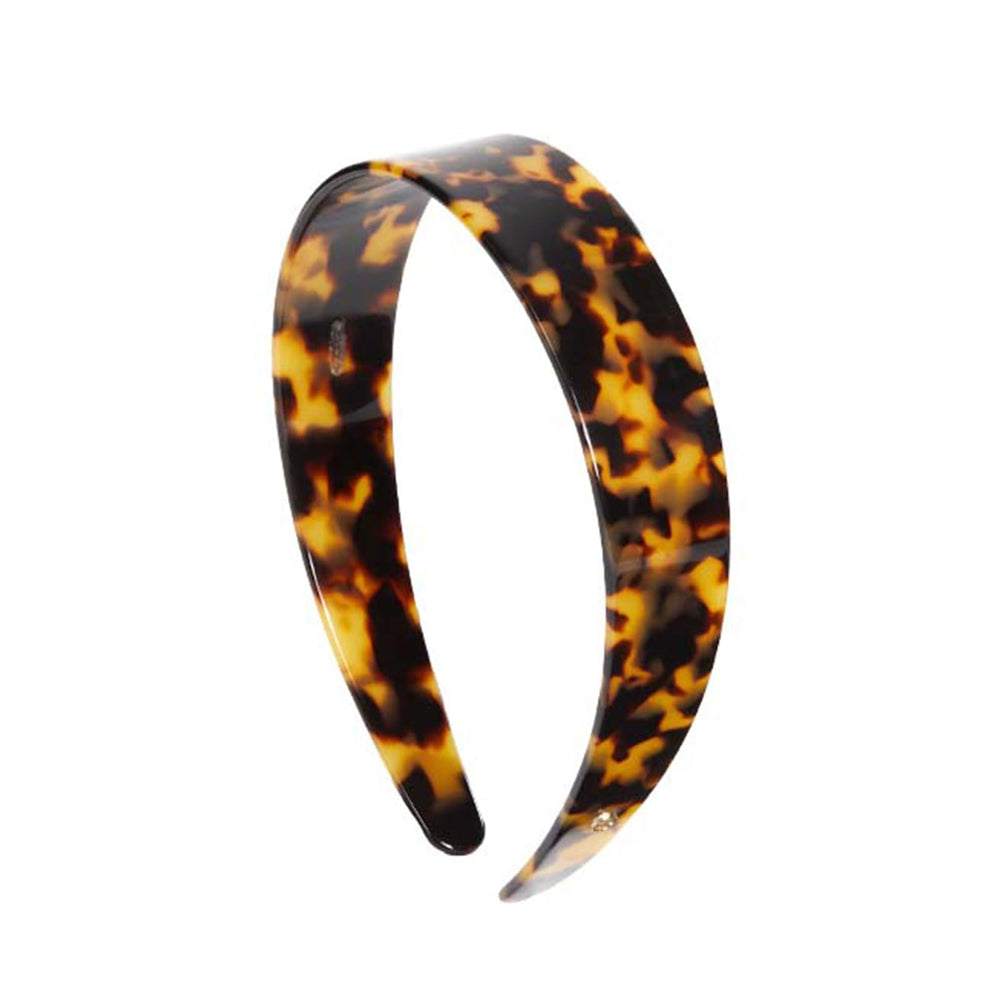 EVITA PERONI front view of tortoise headband showing glossy finish and classic shape for polished style