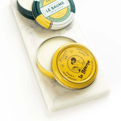 Feret Parfumeur balm being applied to lips for immediate softening benefit