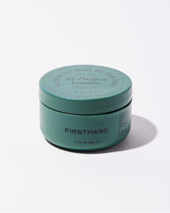Open tub close-up showing creamy pomade texture and easy scoop benefit