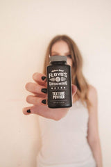 Floyd's 99 powder in hand ready to apply for quick root refresh
