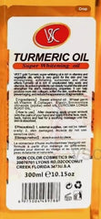 Generic turmeric oil in hand scale showing 300ml bottle size for value