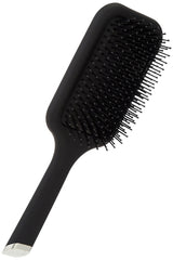 ghd paddle brush in hand styling long hair for efficient blow-drying