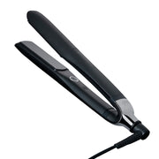 ghd Platinum+ front packaging showing the black styler and brand benefit of professional performance