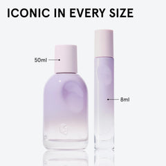 Glossier You Fleur bottle on neutral surface highlighting minimalist design and portability